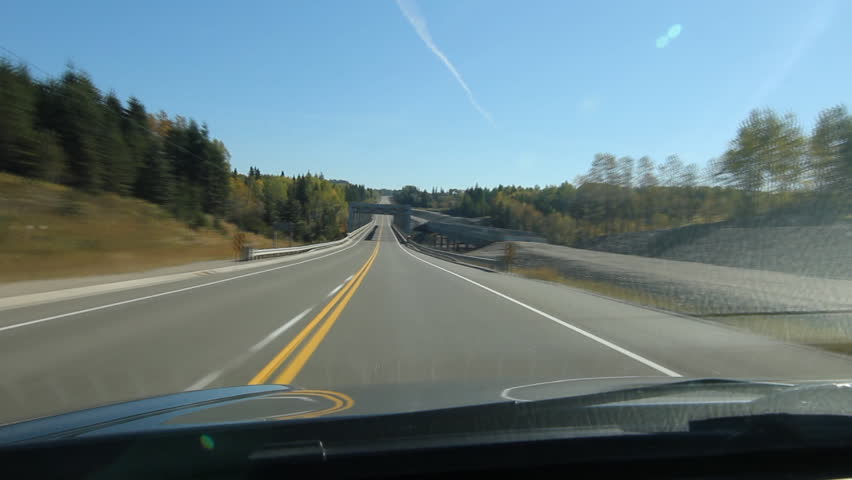 POV Driving across a truss bridge that crosses the Pic River. Time lapse. Footbridge on left and bridge under construction on right. Trans Canada HWY No 1 or Hwy ON-17 in Northern Ontario, Canada.
