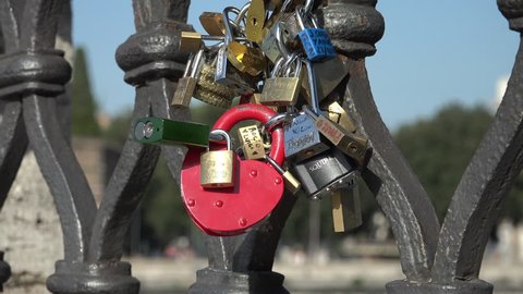 ROME, ITALY - OCT. 2014: Zoom out, then In on Love Locks (love padlocks) on scenic Ponte Sant'Angelo leading to Castle St. Angelo. Love locks are banned on some bridges, causing damage.