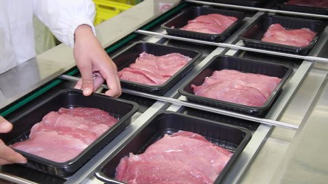 Packaging of beef meat on the production line at the factory