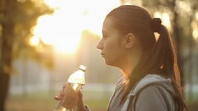 Sportswoman Drinking Water After Sport Activities