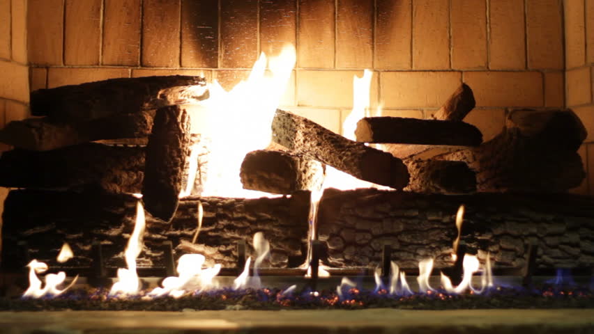 a fireplace glowing warmly in the winter (high flames)