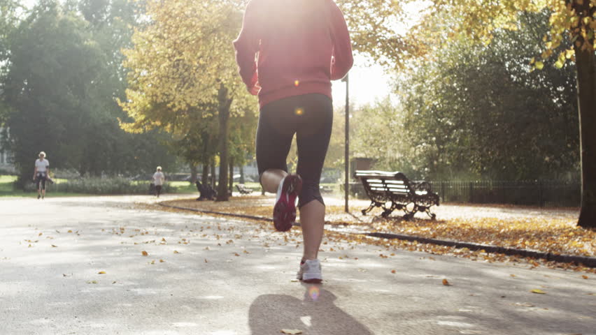 Runner woman running in park excercising outdoors