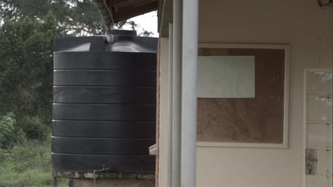 A water tank outside a building in Uganda, Africa.