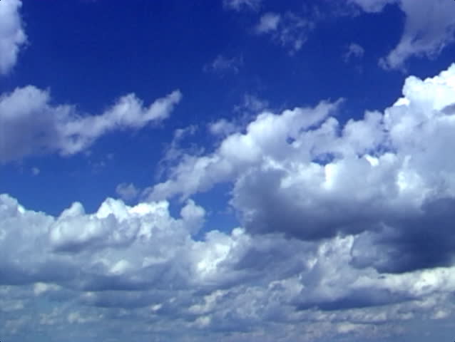 Clouds passing over a blue sky.