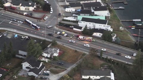 Tragic roadway accident on city street view from news aircraft