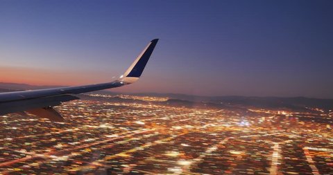 Jet plane landing in Los Angeles LAX airport. Window view with wing. 4K UHD Timelapse.