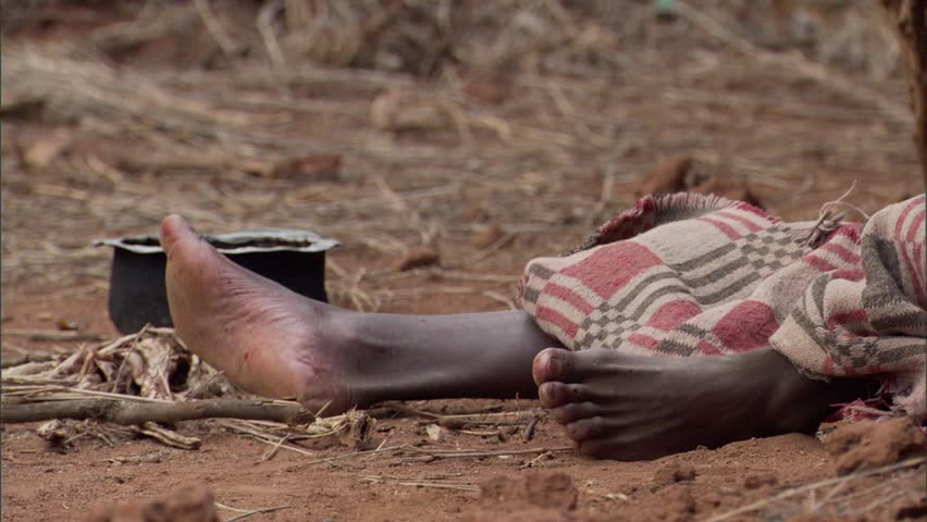 Ebola victim receiving bowl of food. | Shutterstock HD Video #7753162