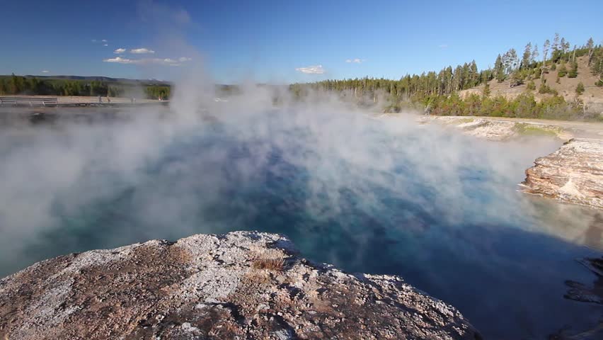 Steam rises off Excelsior Geyser, Midway Geyser Basin, Yellowstone National Park, Wyoming.