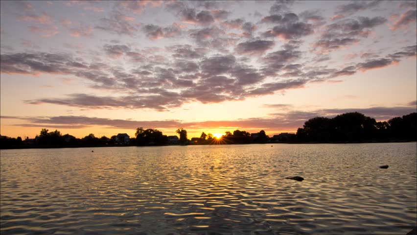Sunset on the lake. Ukraine, rivne,  sky time lapse