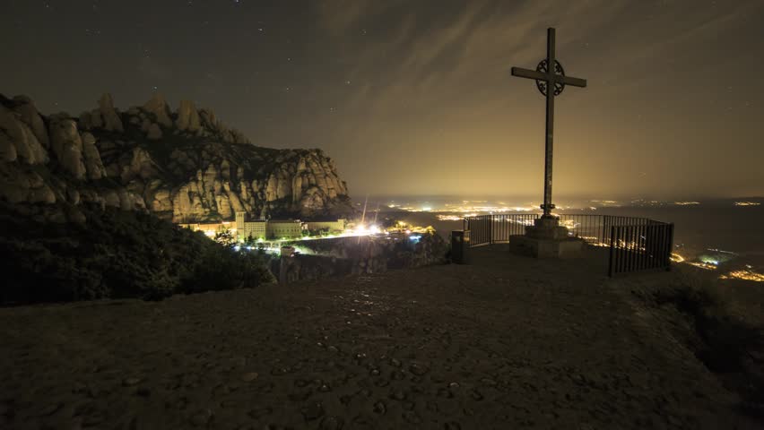 Crucifix / Cross at Montserrat just before sunrise.  Timelapse footage with dolly movement.