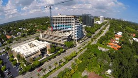 Aerial video of a building under construction with a crane 4k