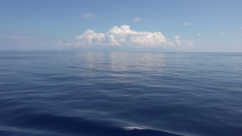 Beautiful Mediterranean Ocean blue white clouds. Beautiful Mediterranean Ocean waves with horizon in distance. Cruise ship vacation in Europe. Environmental and nature with deep blue sea.