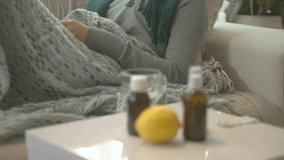 Sick Woman lying on her sofa at home. Flu. Woman Caught Cold. Sneezing into Tissue. Headache. Virus. Medicines. Season Allergy reaction symptoms. HD 1080 video footage