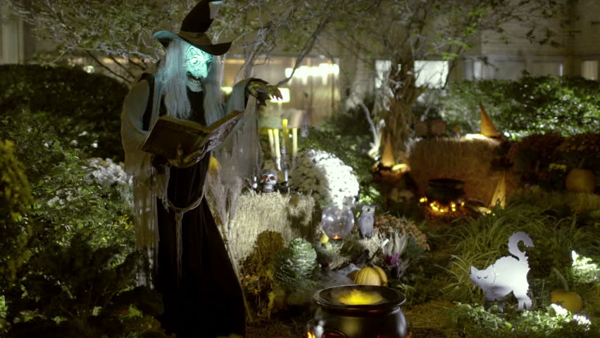 Witch on Halloween - Scary, Spooky Horror Scene at Night with Horrifying Witch Monster Casting Spell over Steaming Smoking Cauldron Royalty-Free Stock Footage #7799659