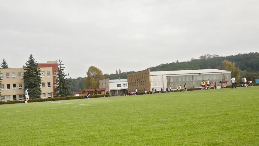 Young caucasian male playing football in slow motion
