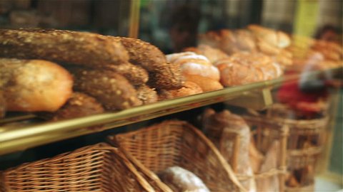 Freshly backed breads in bakery, steadycam shot
