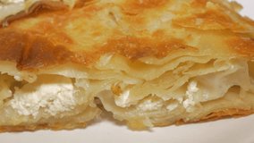 Burek Serbian well known fast food made from dough and cheese 4K 2160p UHD video - Burek traditional  breakfast meal in Serbia 4K 3840X2160 UHD footage