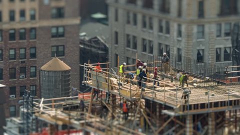Construction workers working on building site in Manhattan, NYC, NY. 4K UHD Timelapse.