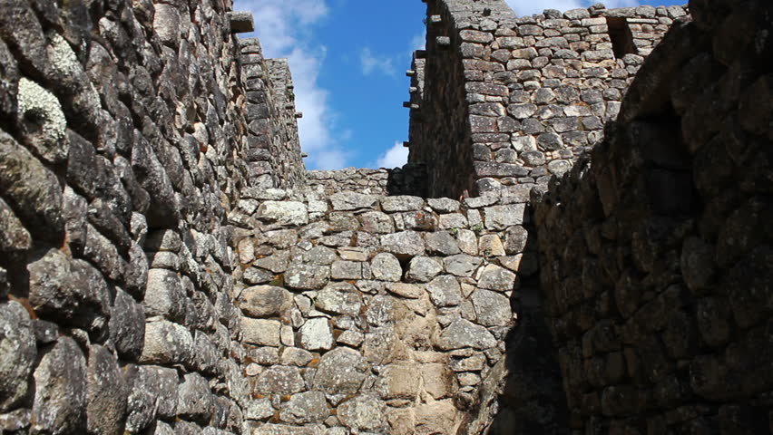 MACHU PICCHU, PERU - CIRCA 2014: Tourist visiting Machu Picchu, Peru - UNESCO World Heritage Site - Circa 2014