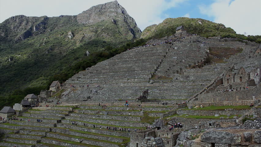 Tourists visiting Machu Picchu, Peru - UNESCO World Heritage Site