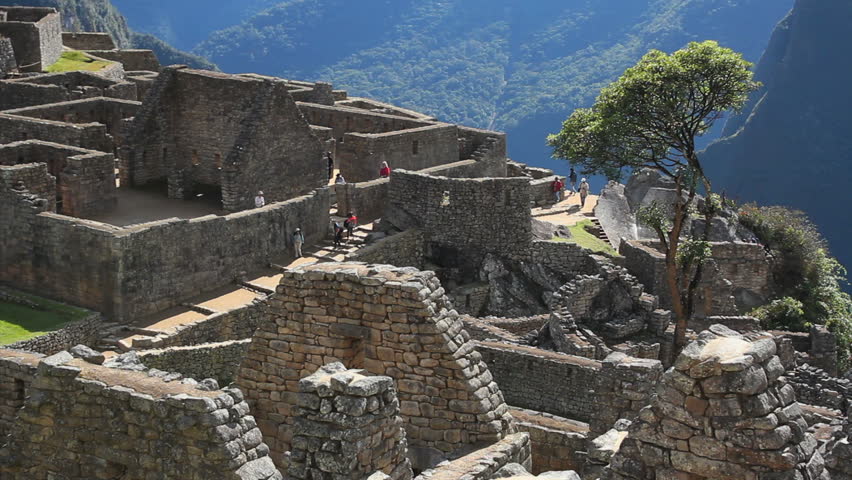 Tourists visiting Machu Picchu, Peru - UNESCO World Heritage Site
