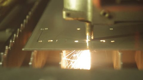 Laser cutting of metal sheet with sparks 