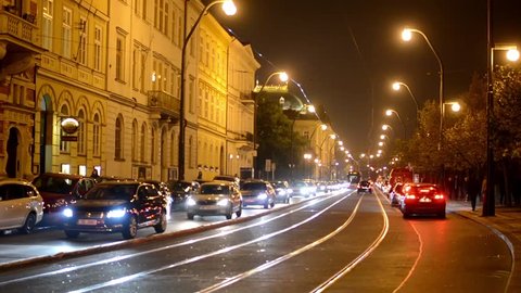 night city - night urban street with cars and trams - lamps(lights) - car headlight