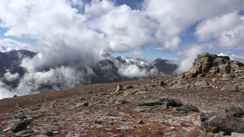 Time lapse of clouds rolling over a mountainside above the t tree line along Trail Ridge Road in Rocky Mountain National Park, Colorado