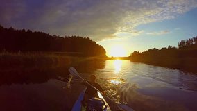 Travelers kayaking at sunset, breathtaking view, sport, slow-mo