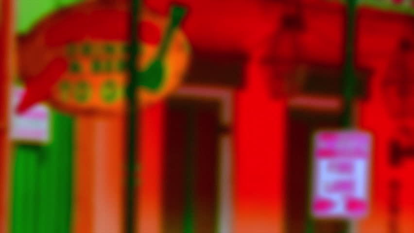 New Orleans Bourbon Street Sign with a Vibrant Colored and Out of Focus Background during French Quarter Festivities