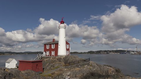4K Time lapse zoom in on Fisgard lighthouse on Vancouver Island, BC in Canada with clouds passing by at daytime
