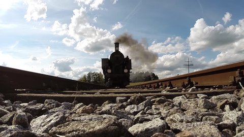 pov view of steam engine locomotive train crossing over camera