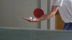 Slow motion clip of a man serving in table tennis, shot on RED EPIC