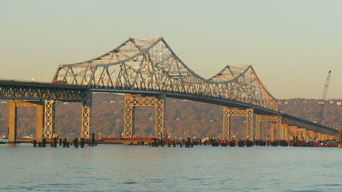 Traffic crosses the Tappan Zee Bridge over the Hudson River between Westchester and Rockland counties. Pilings for the foundation of the new bridge are visible in under the bridge.