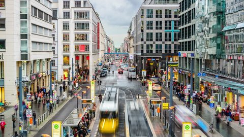 BERLIN, GERMANY - SEPTEMBER 16 2013: Trams and traffic on Friedrichstrasse. The street is the main shopping thoroughfare of the city.
