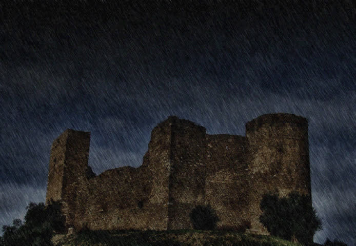 Ancient castle under the storm at night