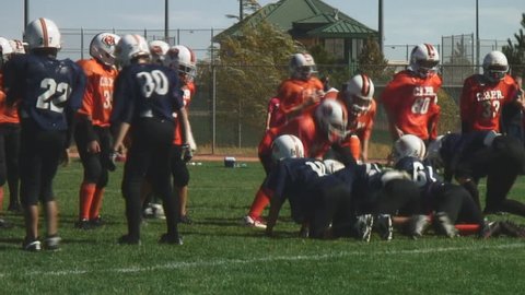 Youth football teams enjoy full contact game-touchdown run; HD, audio 