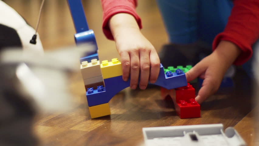 Child playing with blocks, closeup, steadycam shot, slow motion shot at 100fps
 Royalty-Free Stock Footage #7913671
