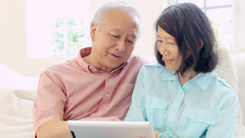 Senior couple at home researching product online using digital tablet. Shot on Sony FS700 at frame rate of 25fps | Shutterstock HD Video #7917223