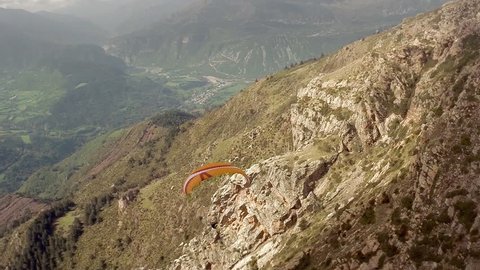Stunning aerial view of paragliders flying over the mountains. Pyrenees, Spain. HD
