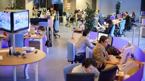 MOSCOW, RUSSIA - MAR 5, 2013: Staff work in big office of RIA Novosti russian news agency