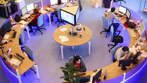 MOSCOW, RUSSIA - MAR 5, 2013: Top view of working people in big office of RIA Novosti russian news agency