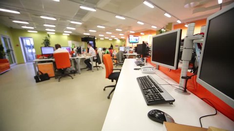 Staff work in office with modern computers and other equipment