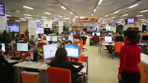 MOSCOW, RUSSIA - MAR 5, 2013: Employees work at tables with computers in office of RIA Novosti russian news agency