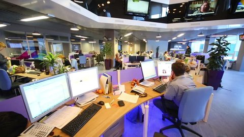 MOSCOW, RUSSIA - MAR 5, 2013: Staff work at computers in modern office of RIA Novosti russian news agency