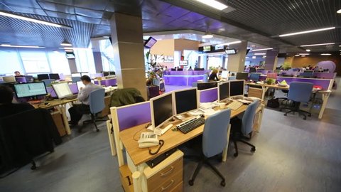 MOSCOW, RUSSIA - MAR 5, 2013: Staff work at modern computers in big office of RIA Novosti russian news agency