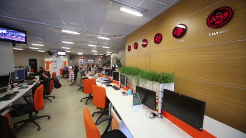 MOSCOW, RUSSIA - MAR 5, 2013: People work at tables with computers in office of RIA Novosti russian news agency