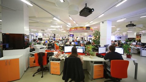MOSCOW, RUSSIA - MAR 5, 2013: Working people in office of RIA Novosti russian news agency
