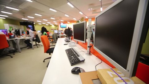 MOSCOW, RUSSIA - MAR 5, 2013: People work in office with modern computers and other equipment