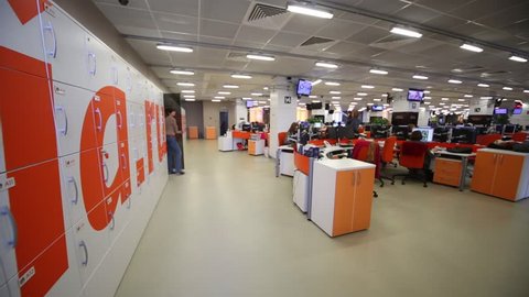 MOSCOW, RUSSIA - MAR 5, 2013: People work in modern office with cell of storage chamber of RIA Novosti russian news agency